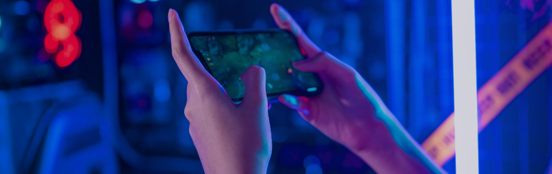 person playing video games on mobile